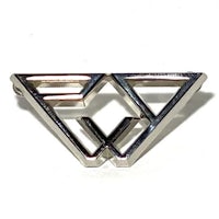 a silver brooch with a triangle on it